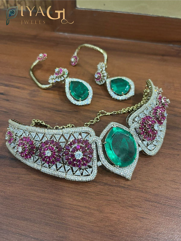 Gold finished floral design green stone artificial jewellery choker set for bridal wear - PiyaGuJwells