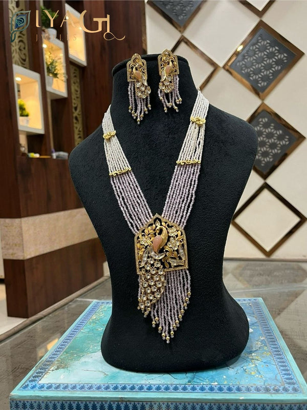Gold-tone white stone peacock design layered necklace set for festive occasions - PiyaGuJwells