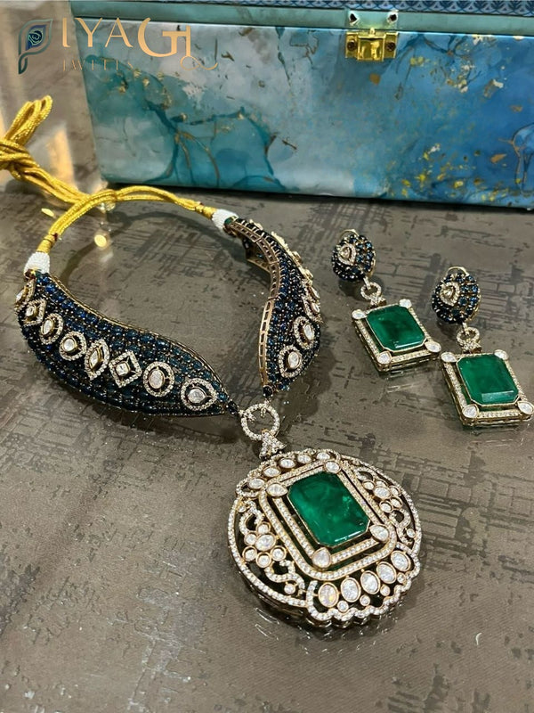 Oxidised silver tone with vibrant green polki stones in a floral design, ideal for festive wear. - PiyaGuJwells