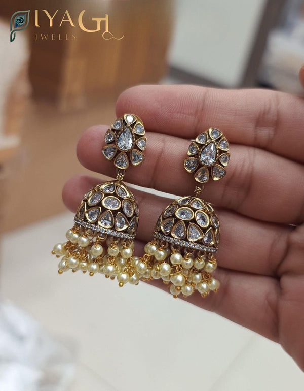 Gold tone floral white stone jhumka earrings set for ethnic wear - PiyaGuJwells