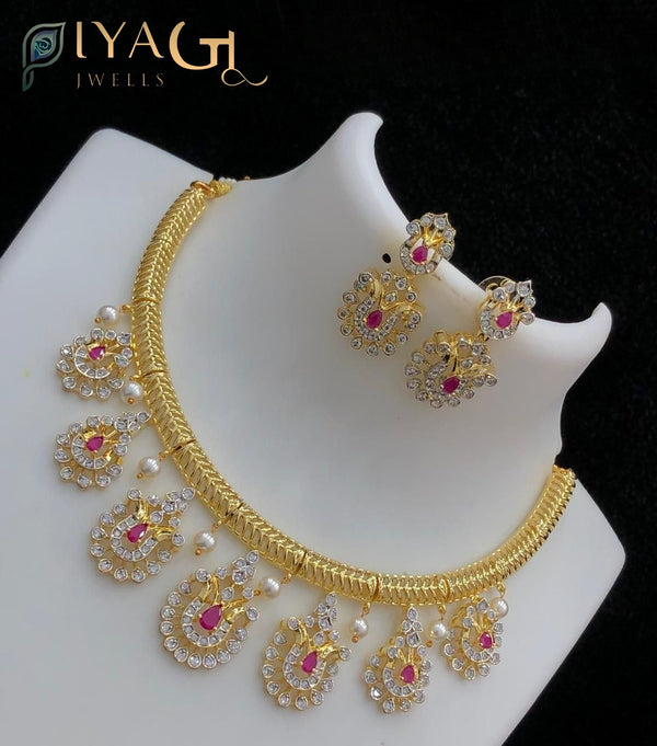 Gold tone white stone polished floral peacock motif choker necklace set for bridal and festive events - PiyaGuJwells
