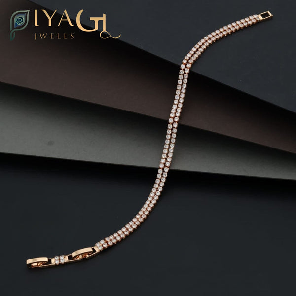White American Diamond gold-tone tennis bracelet for party wear with elegant prong-set design - PiyaGuJwells