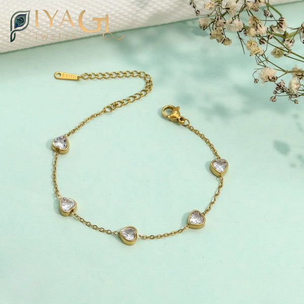 Gold-tone chain bracelet with white American diamonds for party wear - PiyaGuJwells