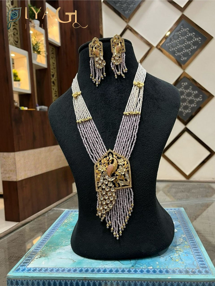 Gold-tone white stone peacock design layered necklace set for festive occasions - PiyaGuJwells