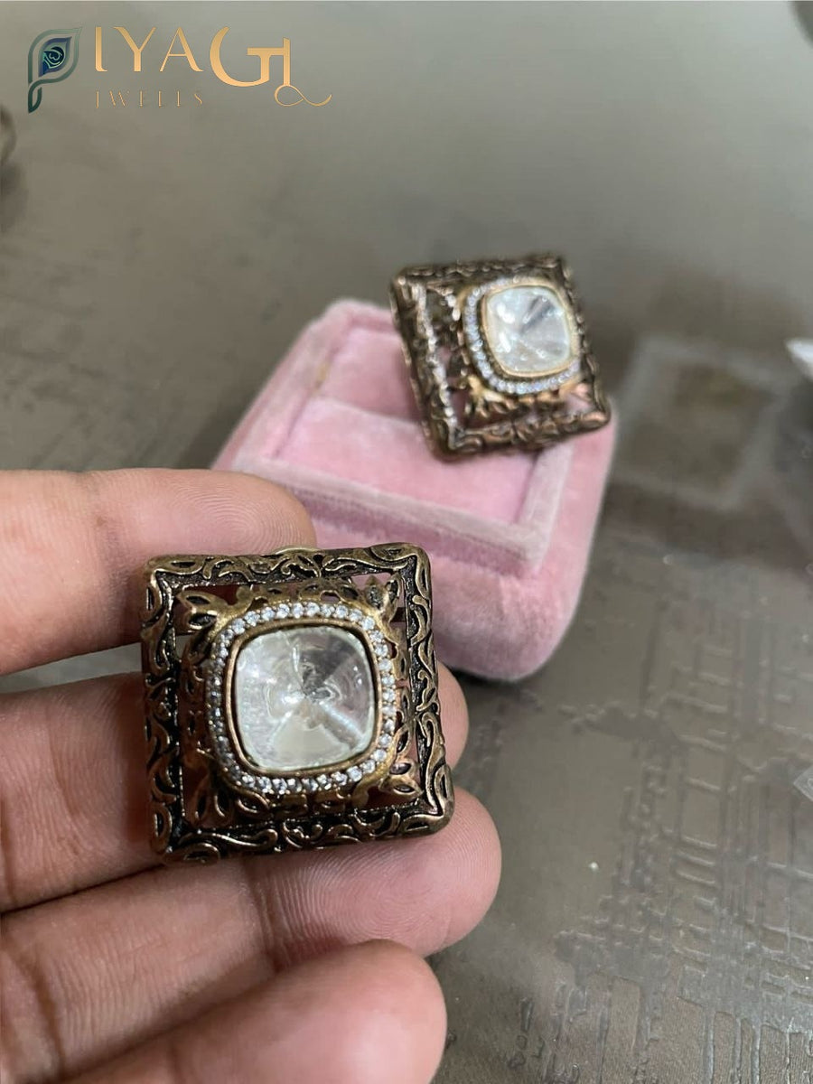 Golden finish white stone stud earrings for a stunning bridal outfit - PiyaGuJwells