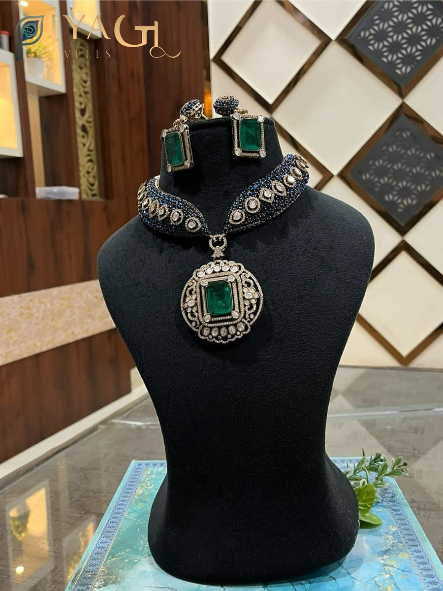 Oxidised silver tone with vibrant green polki stones in a floral design, ideal for festive wear. - PiyaGuJwells