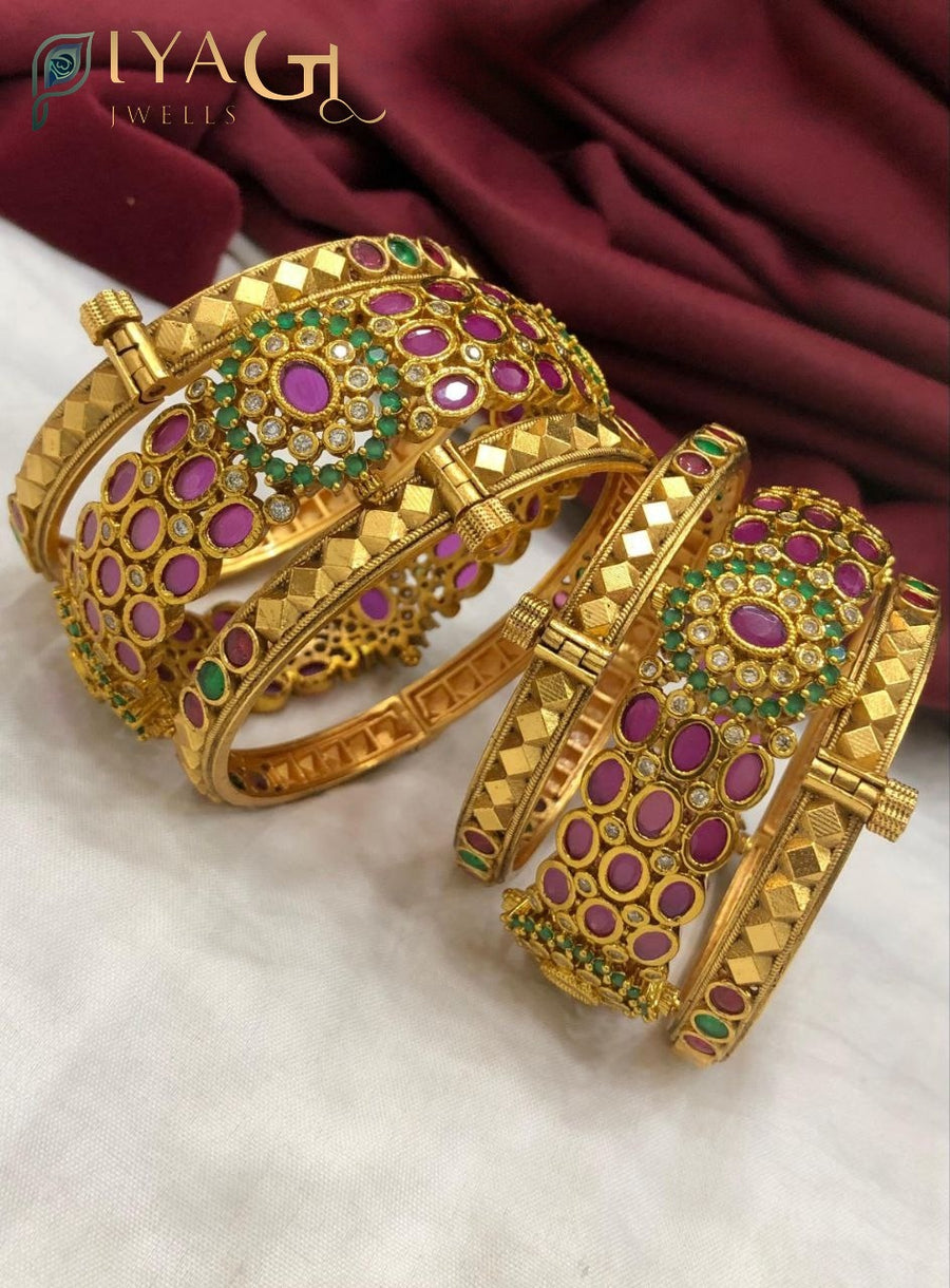 Imitation jewelry set of antique gold bangles with purple and green stones and white accents - PiyaGuJwells