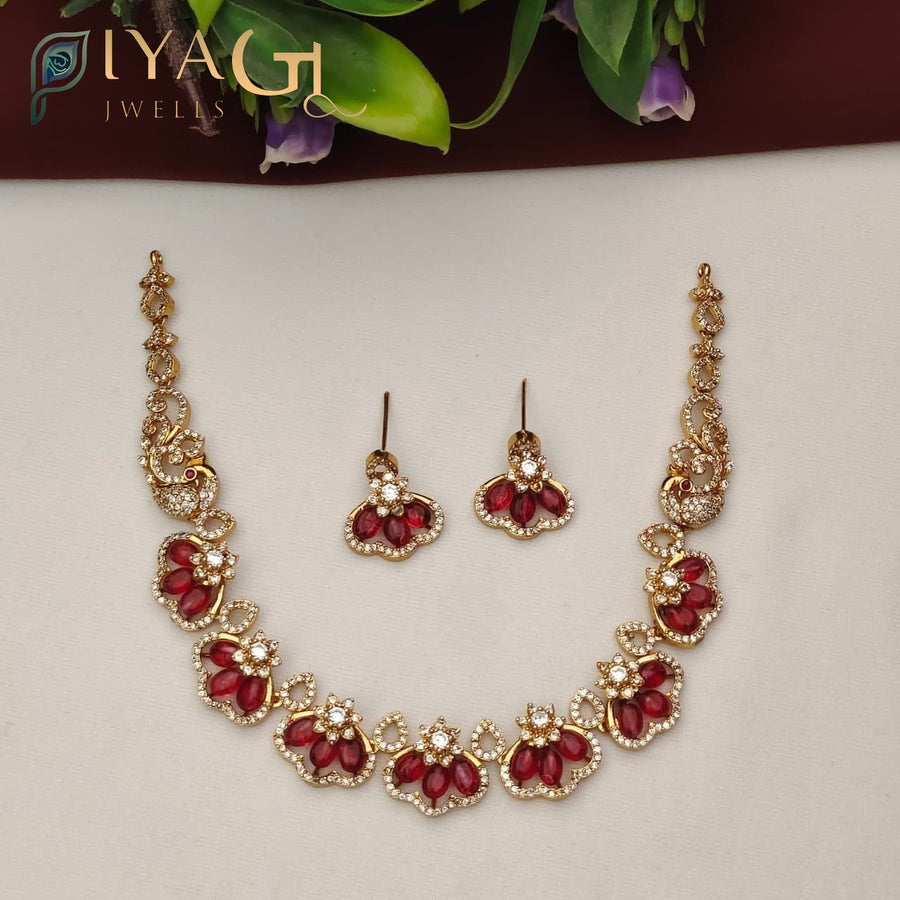 Gold tone floral design red stone stone choker necklace earring set for festive occasions - PiyaGuJwells