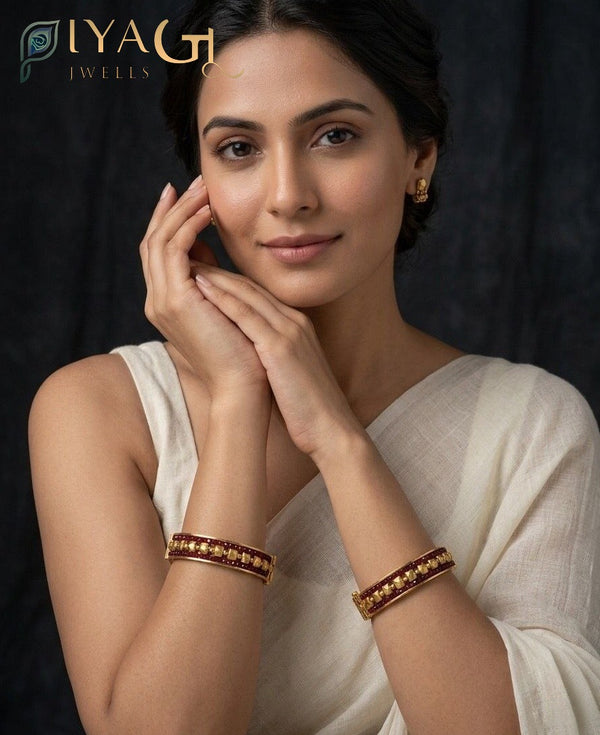 Model wearing antique polish brass metal screw type exclusive bangle kadda with maroon and gold design. - PiyaGuJwells