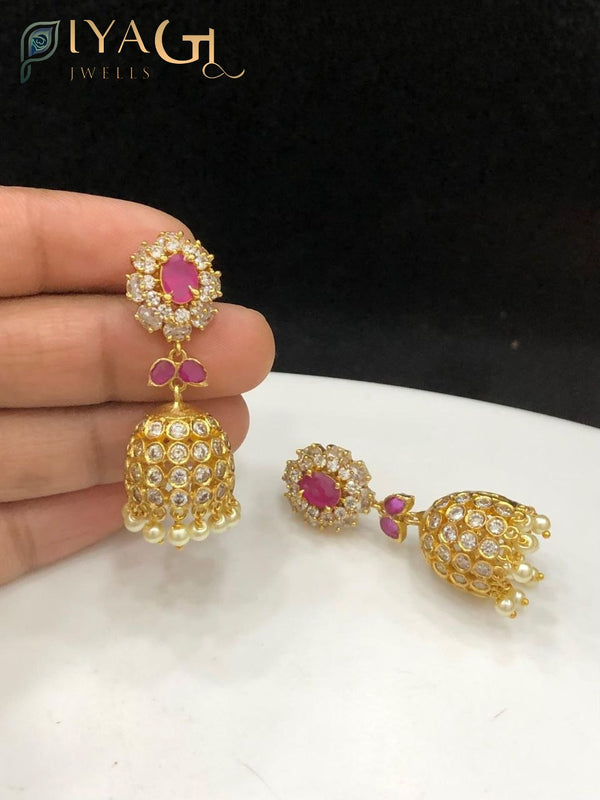 Gold tone red stone floral design antique finish jhumka earrings for ethnic wear - PiyaGuJwells