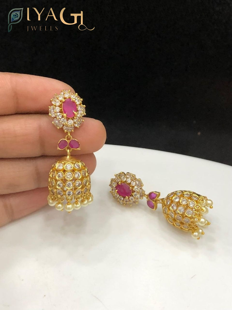 Gold tone red stone floral design antique finish jhumka earrings for ethnic wear - PiyaGuJwells