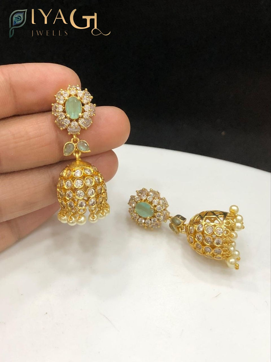 Gold tone red stone floral design antique finish jhumka earrings for ethnic wear - PiyaGuJwells