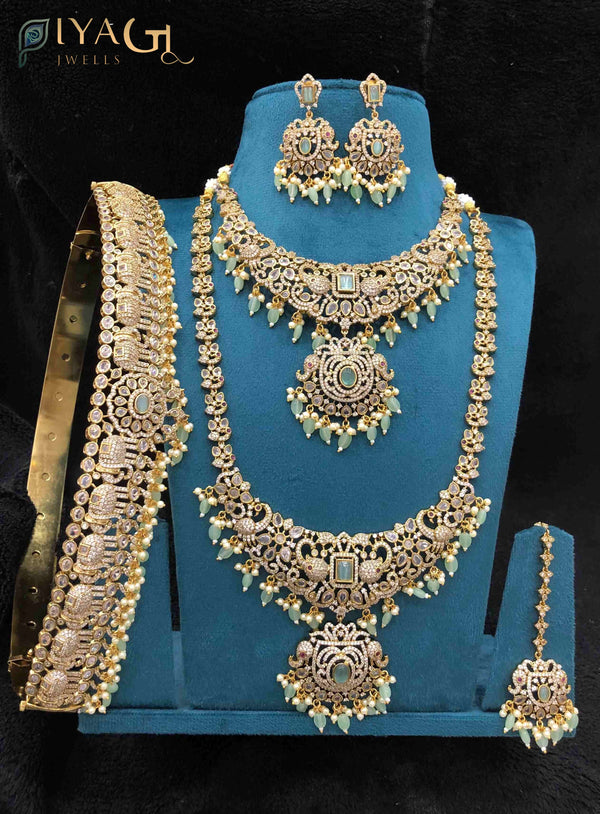 Gold polished layered artificial jewellery set with cubic zirconia stones for bridal wear - PiyaGuJwells