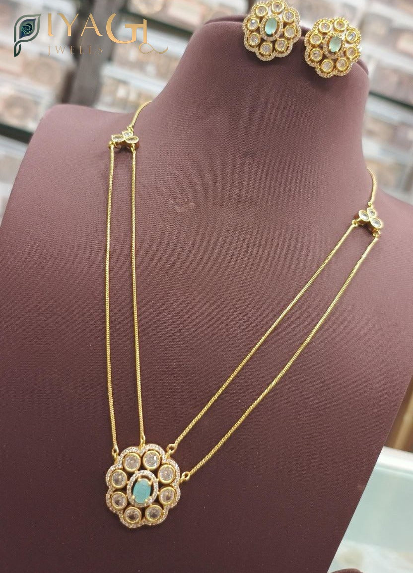 Gold tone floral design stone necklace earring set for festive occasions - PiyaGuJwells