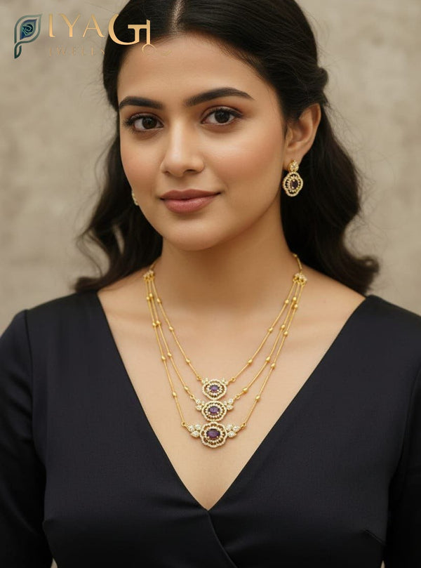 Gold finished blue cubic zirconia floral design layered necklace earring set for festive occasions - PiyaGuJwells