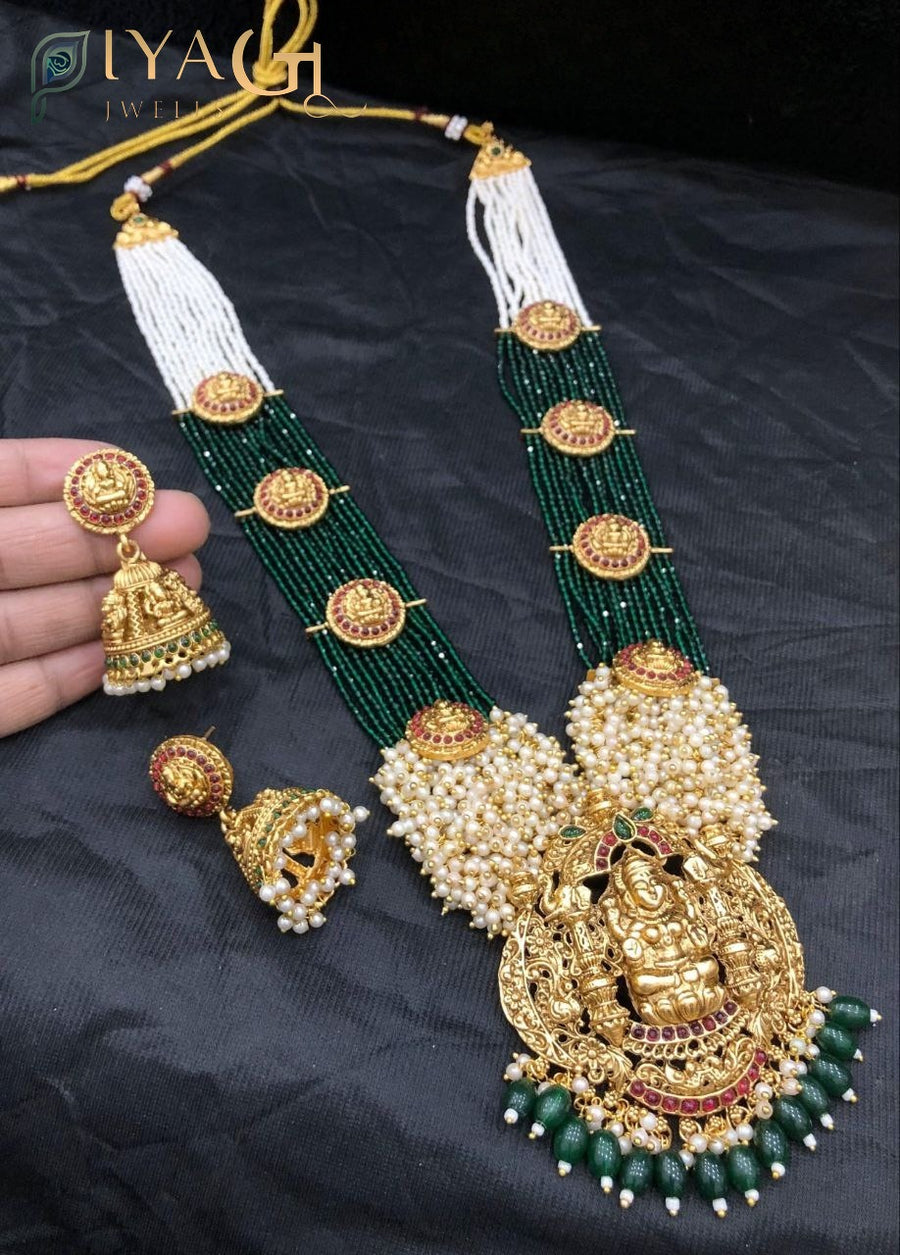 Green kempu stones and white pearls on antiqued gold tone layered necklace set for festive wear - PiyaGuJwells