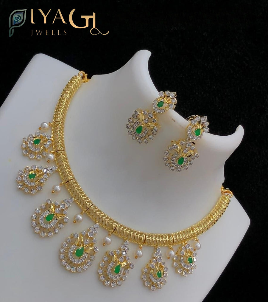 Gold tone white stone polished floral peacock motif choker necklace set for bridal and festive events - PiyaGuJwells
