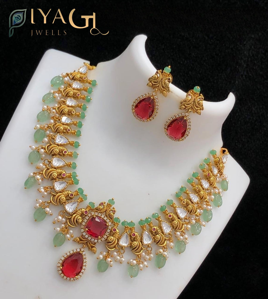 Gold-tone floral red stone necklace for festive wear - PiyaGuJwells