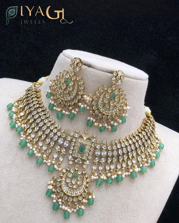 Gold tone, polished finish floral design white stone choker necklace for ethnic wear - PiyaGuJwells