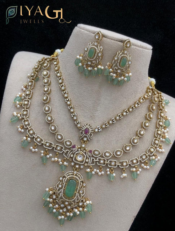 Gold tone necklace featuring green stone stones and floral design for ethnic occasions - PiyaGuJwells