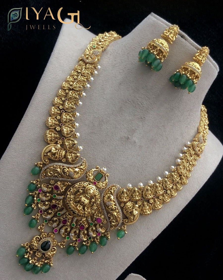Gold polished layered necklace with green jadau stones featuring a floral motif for festive occasions - PiyaGuJwells