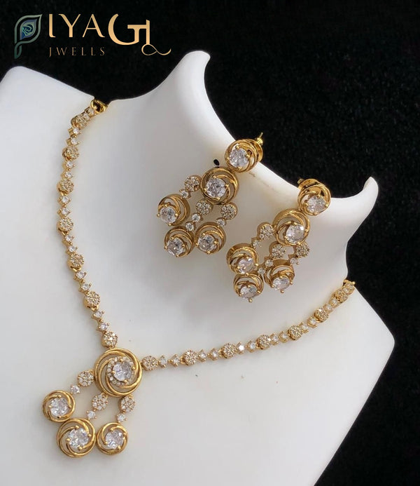 Gold tone white stone teardrop floral design choker necklace for festive occasions - PiyaGuJwells
