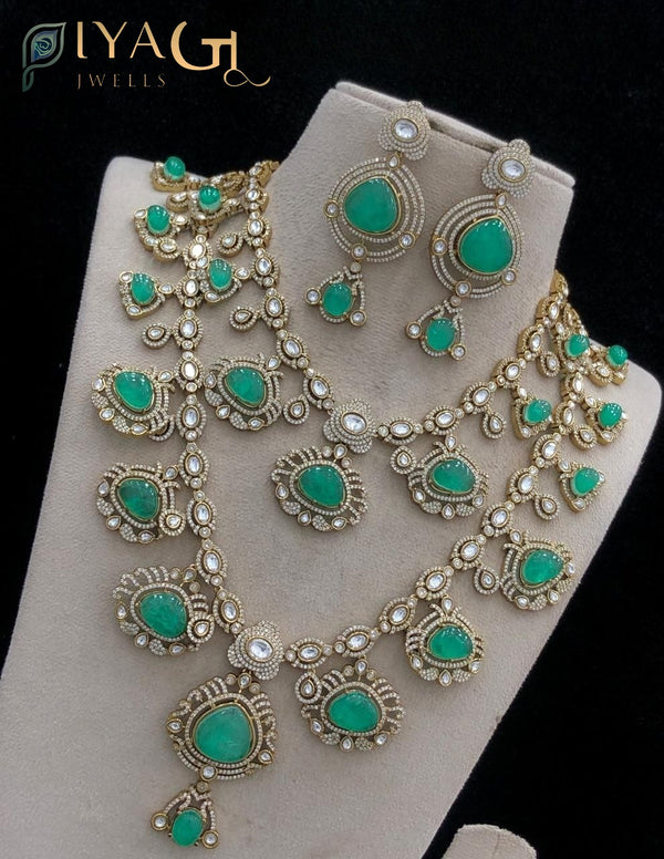 Gold tone green stone polished floral necklace for festive wear - PiyaGuJwells