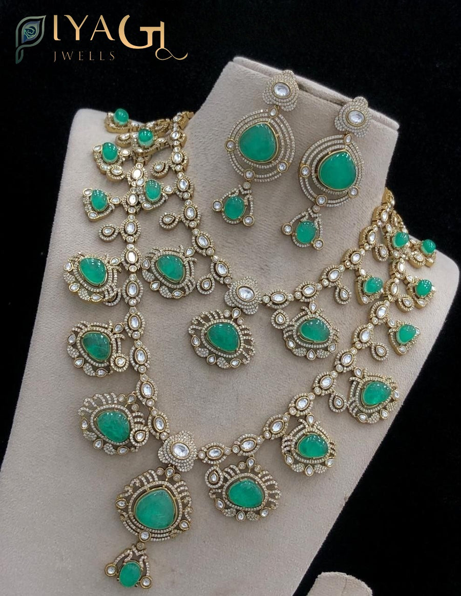 Gold tone green stone polished floral necklace for festive wear - PiyaGuJwells