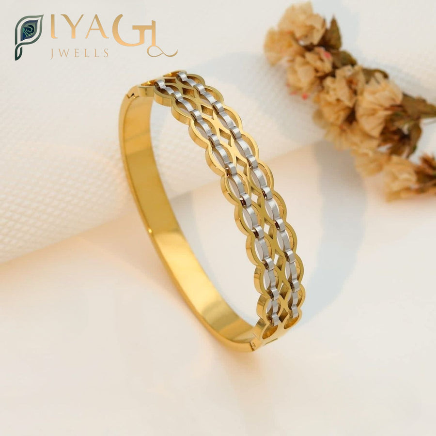 Gold and silver two-tone openable stainless steel bracelet with interlocking oval links. - PiyaGuJwells